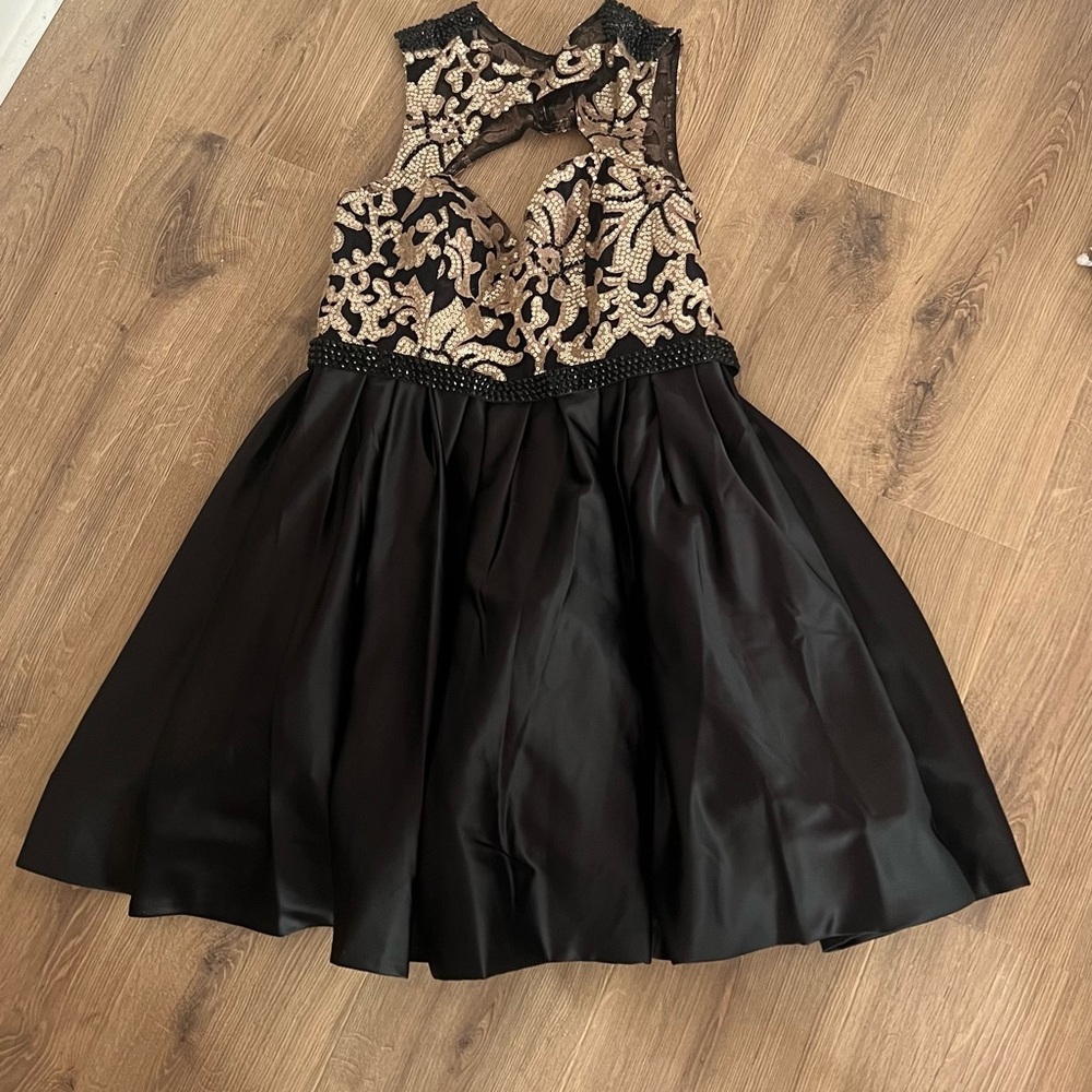 Elegant Black and Gold Women’s Dress